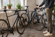 Cyclist inspecting used bike at trendy bike shop for sustainable living