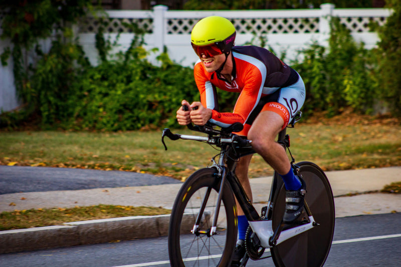 Athlete riding a high-performance triathlon bike with aero wheels, ideal example of a used tri bike in great condition you can find on MyNextBike.co.uk. 