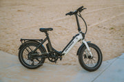Electric hybrid bike designed for urban commuting, featuring step-through frame, electric assist motor and practical rear rack
