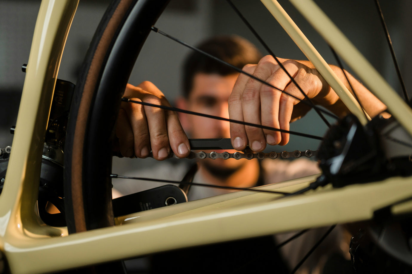 a cyclist closely inspecting a high-end used bike frame before buying