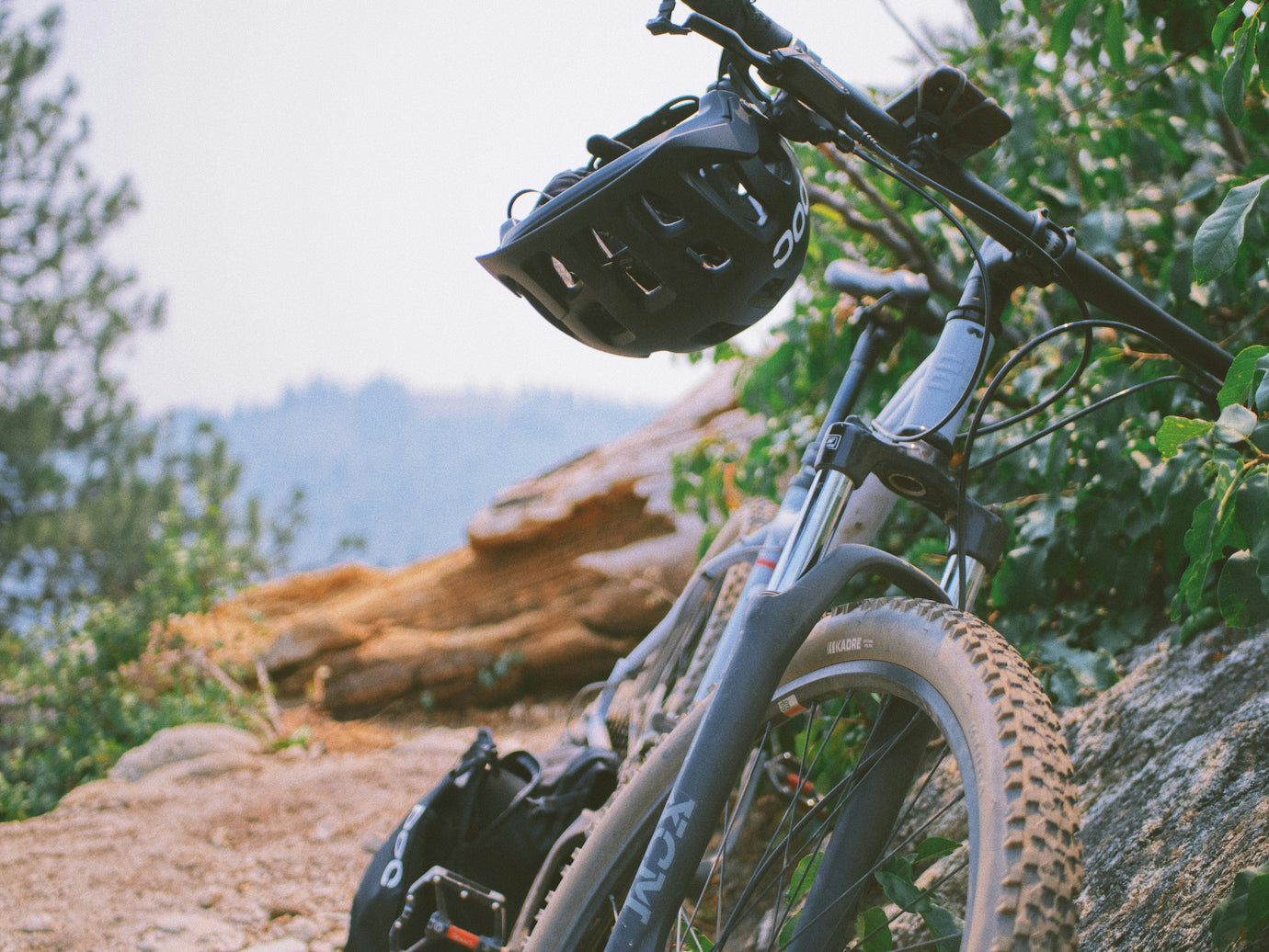 Used mountain bike on an off-road trail, showing front suspension, wide tyres, and trail-ready setup – find your perfect mountain bike on MyNextBike. 