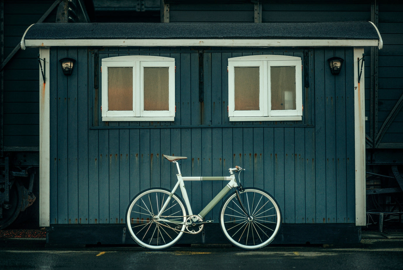 High end commuter bike in front of a shed backdrop displaying luxury road travel and safety UK