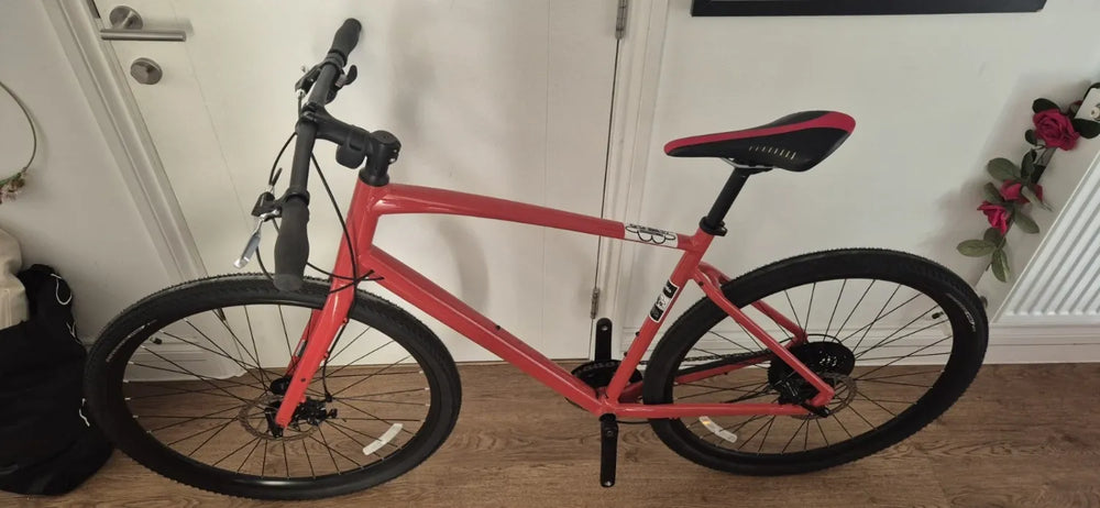 Specialized 	 Specialized Sirrus X 1.0 2025 Hybrid Bike Gloss Deep Orange / Redwood Reflective