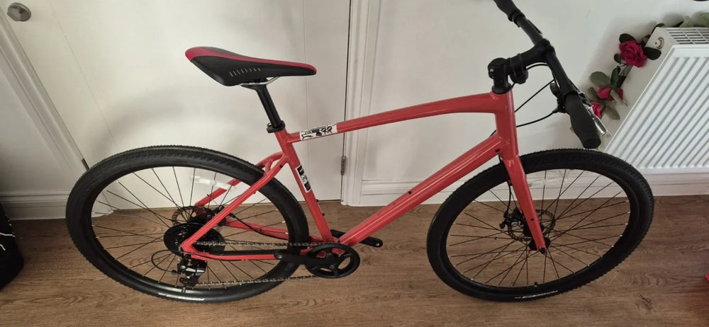 Specialized 	 Specialized Sirrus X 1.0 2025 Hybrid Bike Gloss Deep Orange / Redwood Reflective